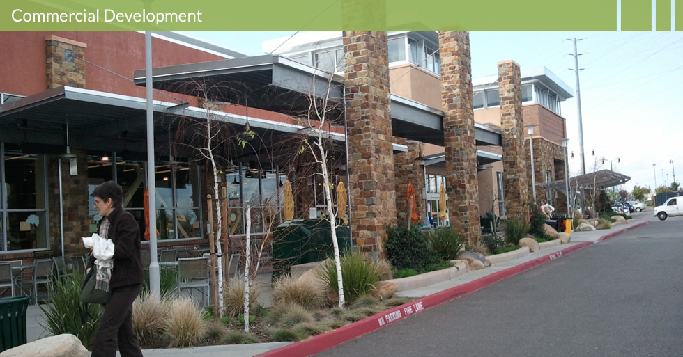 Melton Design Group, a landscape architecture firm, designed the trellis at Whole Foods in Roseville, CA. A modern look, with dark grey and steel protection from weather complete with warm, cobblestone pillars.