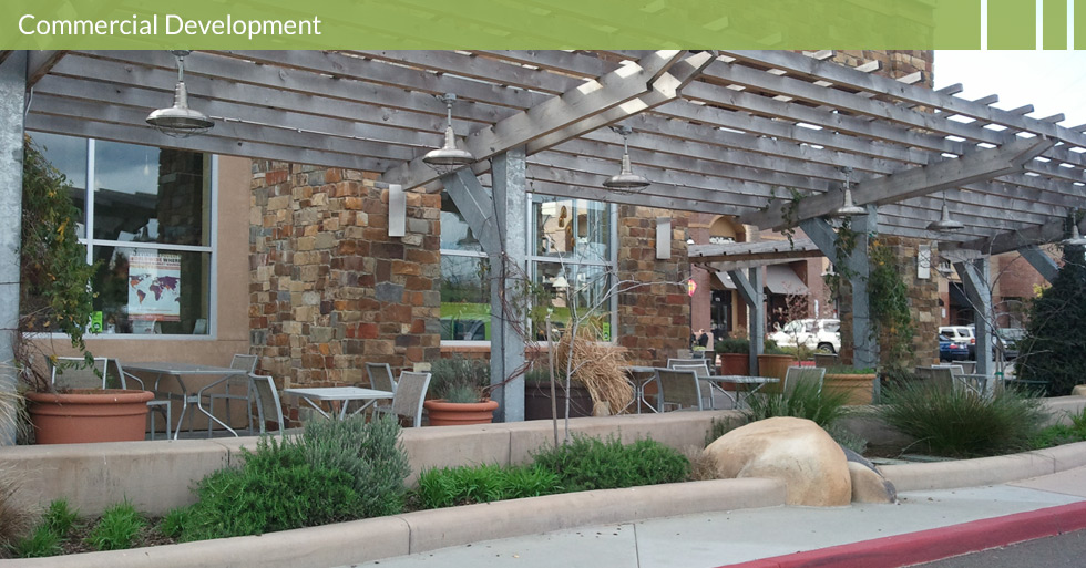 Melton Design Group, a landscape architecture firm, designed the trellis at Whole Foods in Roseville, CA. A modern look, steel protection from weather complete with warm, cobblestone pillars, potted plants and a planters bordering the seating area.