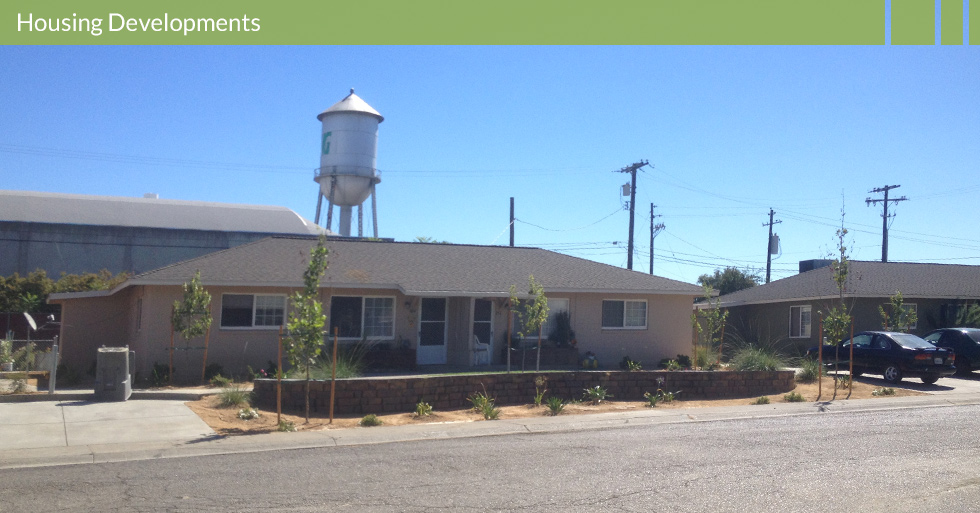 Melton Design Group, a landscape architecture firm, designed this outdoor space for the Housing Authority of Butte County in Gridley, CA. This low water use landscape restoration is complete with grassy plants and a small brick wall for embellishment. 