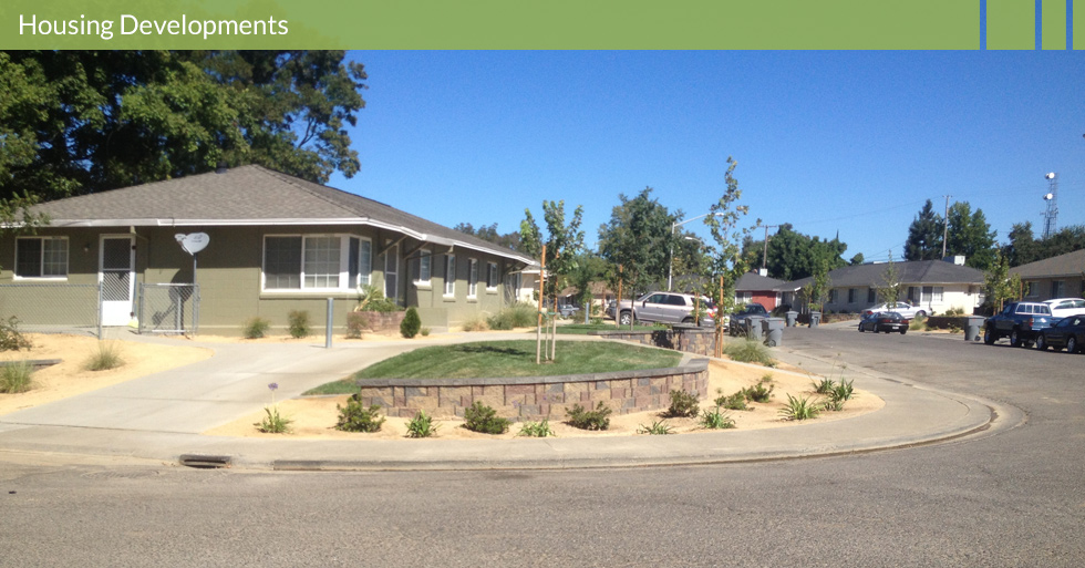 Melton Design Group, a landscape architecture firm, designed this outdoor space for the Housing Authority of Butte County in Gridley, CA. This low maintenance and water use landscape is easy to keep looking fresh, complete with beautiful neutral colored stone work.