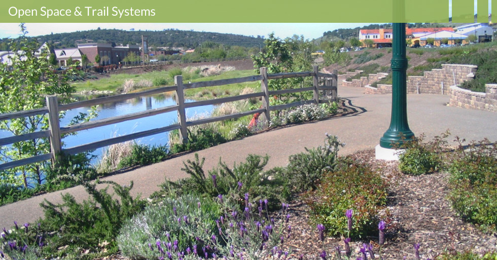 Melton Design Group, landscape architecture firm designed the trail system at Town Center, El Dorado Hills, CA.  Featuring a man-made lake with a water feature and native plants to enhance and guide pedestrians. 